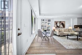 Mississauga (Erin Mills) townhouse for rent - A well-lit, modern living room with a dining area in the middle.