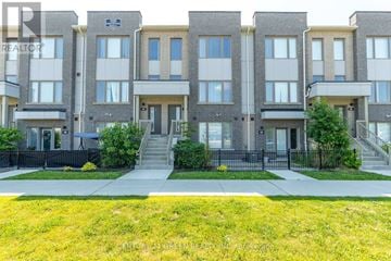 Pickering (Town Centre) townhouse for rent - A building with the sign "REALTOR" on the front.