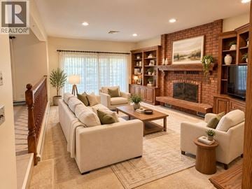 Burnaby apartment for rent - A living room with a fireplace and a painting on the wall.