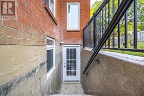 Ajax (Central West) apartment for rent - A small white door with a window above it is the main focus of the image.