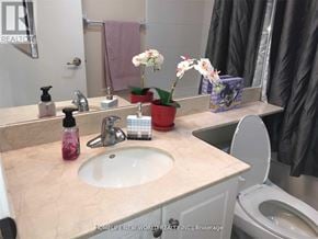 Toronto (Church-Yonge Corridor) condo for rent - A bathroom with a sink, toilet, and a mirror.