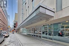 Toronto (Church-Yonge Corridor) condo for rent - A street view of a building with the number 210 on it.
