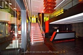 Toronto (Church-Yonge Corridor) condo for rent - A staircase with a glass railing and a red carpet.