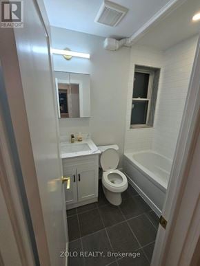 Toronto (Bedford Park-Nortown) apartment for rent - A bathroom with a toilet, sink, and bathtub.