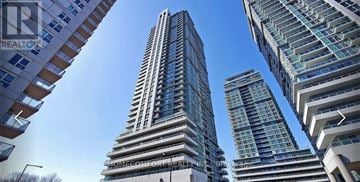 Toronto (Bendale) condo for rent - A tall building with the words LOWEGCOMFORT REALTORS on it.