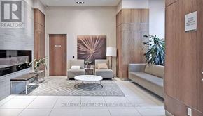 Toronto (Bendale) condo for rent - A realtor's office with a large couch and a coffee table.