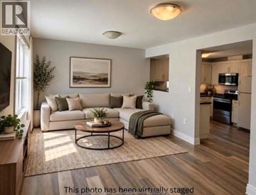 Lakeshore apartment for rent - A living room with a white couch and a coffee table.