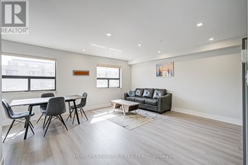 Toronto (South Parkdale) apartment for rent - A living room with a grey couch and a coffee table.
