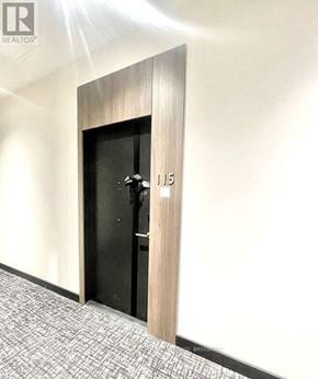Oakville (Ga Glen Abbey) condo for rent - A door with a black door and a wooden frame with the number 15 on it.