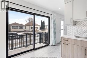 Windsor apartment for rent - A kitchen with a view of a snowy landscape outside.