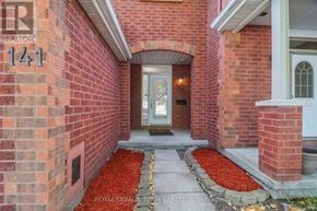 Ottawa townhouse for rent - A red brick house with a number 141 on it.
