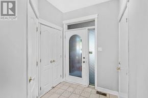 Ottawa townhouse for rent - A white door with a glass window is in a white room.