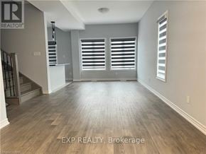 Welland (N. Welland) house for rent - A room with wooden flooring and a staircase on the left side.