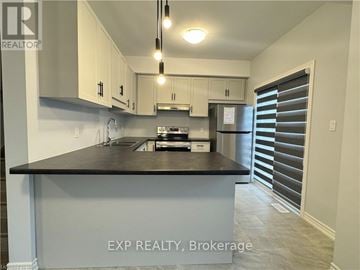 Welland (N. Welland) house for rent - A kitchen with EXP Realty Brokerage written on the island.