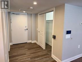 Thorold (Thorold Downtown) apartment for rent - A room with a white door and a glass door leading to a balcony.
