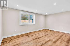 Newmarket (Gorham-College Manor) apartment for rent - A room with a wooden floor and a window.