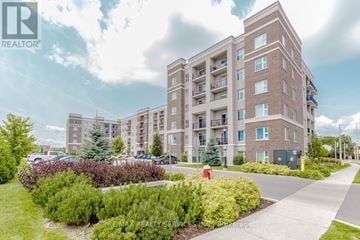 Milton (Wi Willmott) condo for rent - A building with a red fire hydrant in front of it.