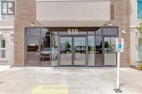 Milton (Wi Willmott) condo for rent - The front of a building with a sign that says REALTOR.