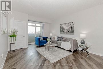 Milton (Wi Willmott) condo for rent - A living room with a blue couch and a coffee table.