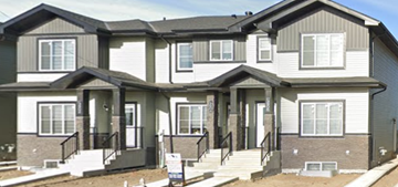 Beaumont apartment for rent - A two-story house with a grey and white exterior.