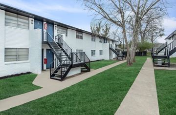 East Point apartment for rent - A white apartment building with black railings and staircases.