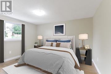 Cambridge apartment for rent - A bedroom with a large bed and a flat screen TV mounted on the wall.