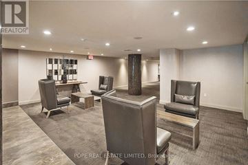 Toronto (Niagara) condo for rent - A living room with a grey sofa and a wooden coffee table.