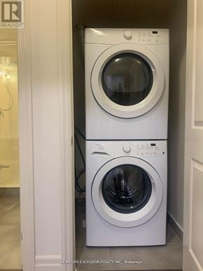Markham (Unionville) condo for rent - A white dryer and washer in a small laundry room.