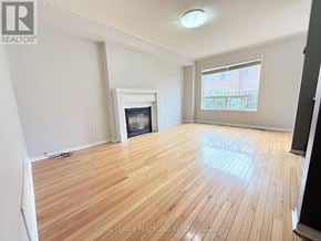 Richmond Hill (Westbrook) apartment for rent - A room with a fireplace and a window.