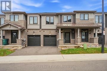 Cambridge townhouse for rent - A row of houses with the Affinity Real Estate logo on the front.