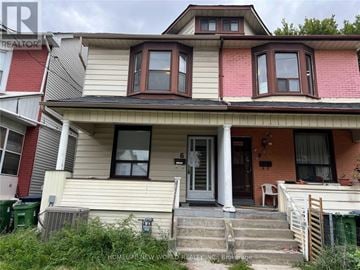 Toronto (South Riverdale) apartment for rent - A two-story house with a red door and a porch.