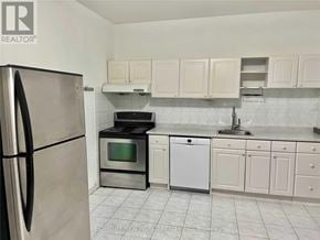 Toronto (South Riverdale) apartment for rent - A kitchen with a refrigerator, microwave, oven, and dishwasher.