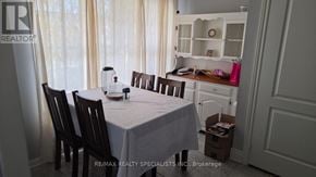 Milton (Co Coates) apartment for rent - A dining room with a table set for two and chairs.