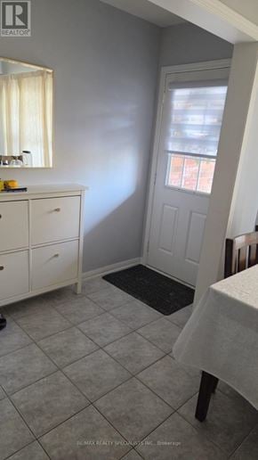 Milton (Co Coates) apartment for rent - A small room with a white cabinet and a table with a white cloth on it.