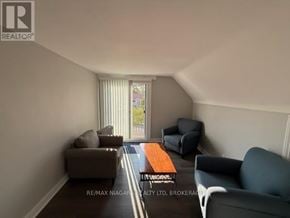Thorold (Thorold Downtown) apartment for rent - A living room with a couch, chair, and coffee table.