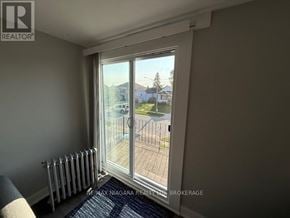 Thorold (Thorold Downtown) apartment for rent - A room with a window overlooking a street.