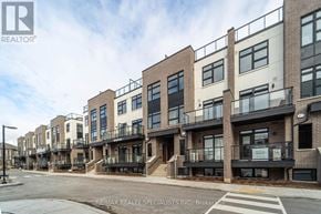 Milton (Cb Cobban) townhouse for rent - A street view of a row of townhouses with a RE/MAX Realty sign in the foreground.