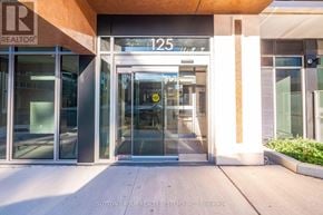 Milton (Tm Timberlea) condo for rent - The entrance to a building with a glass door and a sign that reads "REALTOR".