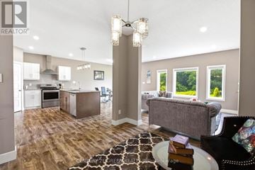 London North (North I) apartment for rent - A well-lit living room with a grey couch and a coffee table.