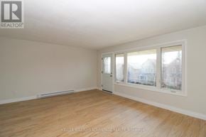 Peterborough (Town Ward 3) triplex for rent - A room with a window and a door is available for rent.