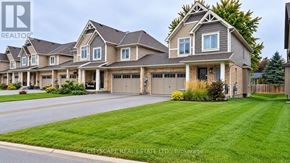 Grey Highlands townhouse for rent - A large, well-maintained house with a driveway and garage is for sale.