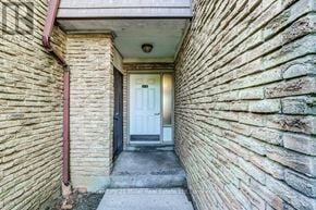 Mississauga (Sheridan) townhouse for rent - A white door is at the end of a hallway.