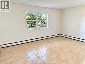 Windsor apartment for rent - A room with a large window and tiled flooring.