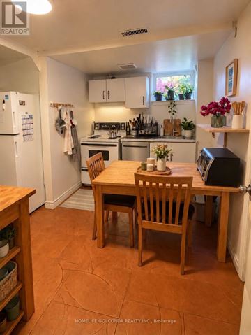 Toronto (Willowdale West) apartment for rent - A kitchen with a table and chairs in the middle of the room.