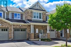 Milton (Co Coates) townhouse for rent - A house with a tree in front of it.