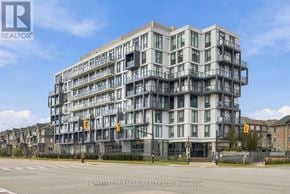 Brampton (Northwest Brampton) condo for rent - A large, modern building with many windows and balconies is the main focus of the image.