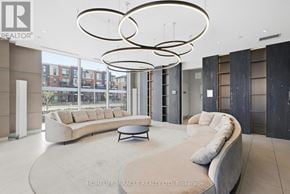 Brampton (Northwest Brampton) condo for rent - A modern living room with a large couch and a coffee table.