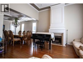 Richmond apartment for rent - A living room with a piano and a fireplace.