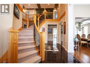 Richmond apartment for rent - A large foyer with a staircase and a chandelier.
