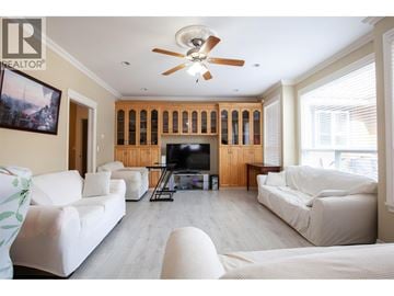 Richmond apartment for rent - A living room with a white couch and a television.
